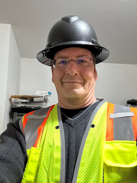 Brian Keever in hardhat and vest